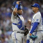 
              Kansas City Royals catcher Salvador Perez, left, talks with starting pitcher Carlos Hernandez, who had given up an RBI double to Colorado Rockies' Brendan Rodgers during the fifth inning of a baseball game Saturday, May 14, 2022, in Denver. (AP Photo/David Zalubowski)
            