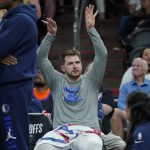 
              Dallas Mavericks guard Luka Doncic celebrates on the bench during the second half of Game 7 of an NBA basketball Western Conference playoff semifinal against the Phoenix Suns, Sunday, May 15, 2022, in Phoenix. The Mavericks defeated the Suns 123-90. (AP Photo/Matt York)
            