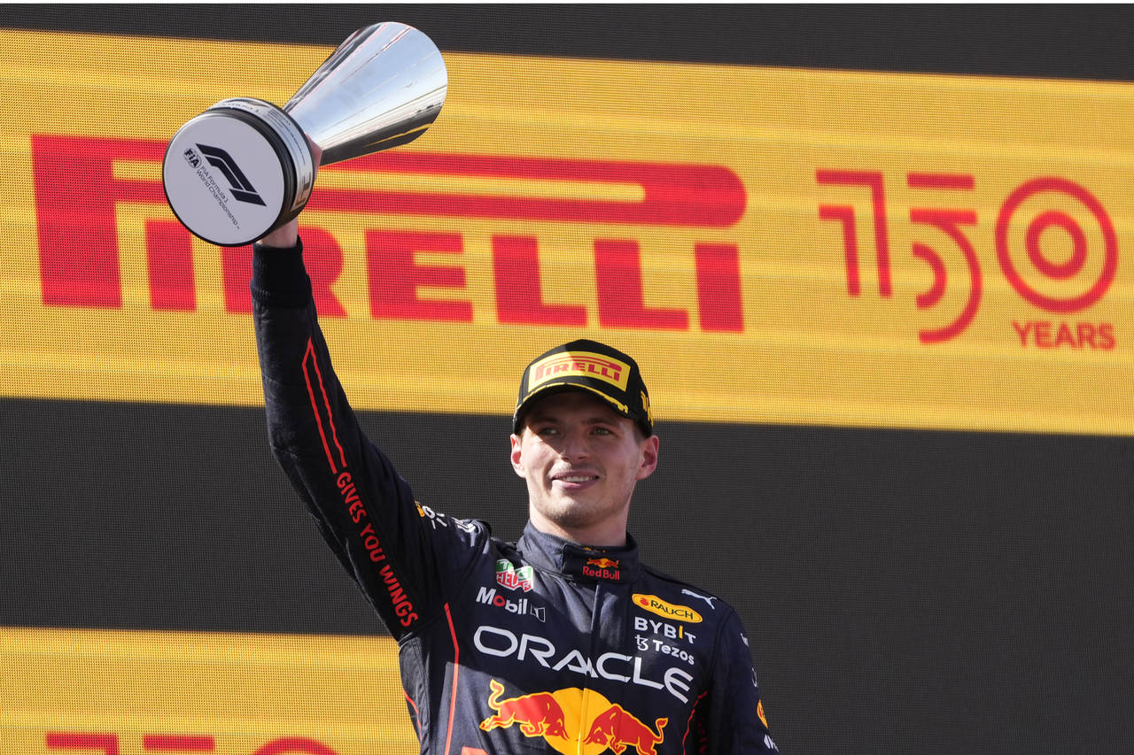 Red Bull driver Max Verstappen, of the Netherlands, celebrates on the podium after winning the Span...