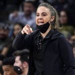 
              FILE- San Antonio Spurs assistant coach Becky Hammon directs players during the first half of an NBA basketball game against the Dallas Mavericks, on Nov. 12, 2021, in San Antonio.  The WNBA will begin its 26th season this weekend with many fascinating storylines including the potential retirement of Sue Bird and Sylvia Fowles, the return of Becky Hammon as a coach and the absence of Brittney Griner. (AP Photo/Eric Gay, File)
            