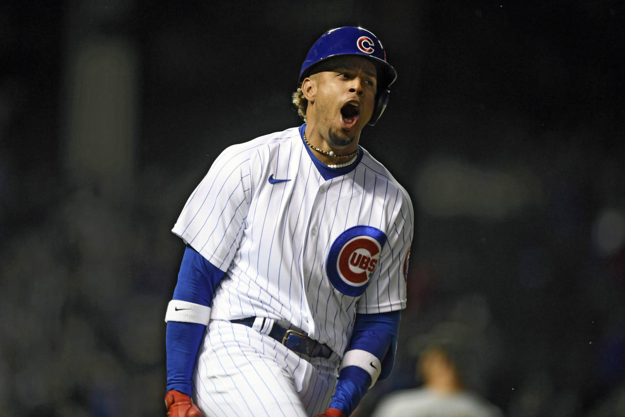 Chicago Cubs' Christopher Morel reacts after hitting a solo home run in his first major league at b...