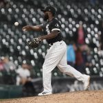 
              Chicago White Sox position player Josh Harrison pitches during the ninth inning of the team's baseball game against the Boston Red Sox on Thursday, May 26, 2022, in Chicago. The Red Sox won 16-7. (AP Photo/Charles Rex Arbogast)
            