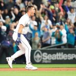 SEATTLE, WASHINGTON - JUNE 11: Dylan Moore #25 of the Seattle Mariners celebrates after hitting a walk-off RBI single to defeat the Boston Red Sox by a score of 7-6 during the ninth inning at T-Mobile Park on June 11, 2022 in Seattle, Washington. (Photo by Abbie Parr/Getty Images)