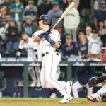 SEATTLE, WASHINGTON - JUNE 11: Dylan Moore #25 of the Seattle Mariners hits the game-winning RBI single to defeat the Boston Red Sox by a score of 7-6 during the ninth inning at T-Mobile Park on June 11, 2022 in Seattle, Washington. (Photo by Abbie Parr/Getty Images)