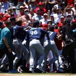 ANAHEIM, CALIFORNIA - JUNE 26:   The Seattle Mariners and the Los Angeles Angels clear the benches after Jesse Winker #27 of the Seattle Mariners charged the Angels dugout after being hit by a pitch in the second inning at Angel Stadium of Anaheim on June 26, 2022 in Anaheim, California. (Photo by Ronald Martinez/Getty Images)