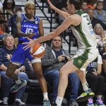 
              Connecticut Sun guard Courtney Williams (10) defects the ball off Seattle Storm forward Breanna Stewart (30) in the corner during a WNBA basketball game Friday, June 17, 2022, in Uncasville, Conn. (Sean D. Eliot/The Day via AP)
            