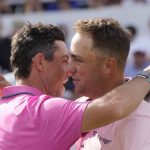 
              Rory McIlroy, left, hugs Justin Thomas on the 18th green after winning the Canadian Open golf tournament in Toronto on Sunday, June 12, 2022. (Frank Gunn/The Canadian Press via AP)
            
