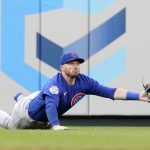 
              Chicago Cubs left fielder Ian Happ dives to stop a fly by St. Louis Cardinals' Juan Yepez for a single during the second inning of a baseball game Friday, June 24, 2022, in St. Louis. Happ was able to throw out Yepez at second on the play. (AP Photo/Jeff Roberson)
            