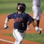 
              Mississippi's Peyton Chatagnier (1) celebrates as he scores a run against Southern Mississippi in the fourth inning of an NCAA college baseball tournament super regional game against Southern Mississippi, Saturday, June 11, 2022, in Hattiesburg, Miss. (AP Photo/Rogelio V. Solis)
            