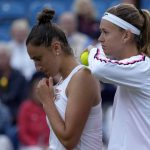
              Marie Bouzkova of Czech Republic, right, and Sara Sorribes Tormo of Spain talk during their doubles tennis match against Serena Williams of the United States and Ons Jabeur of Tunisia at the Eastbourne International tennis tournament in Eastbourne, England, Tuesday, June 21, 2022. (AP Photo/Kirsty Wigglesworth)
            