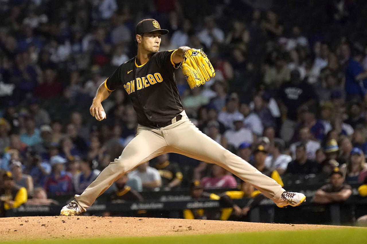 San Diego Padres starting pitcher Yu Darvish winds up during the first inning of a baseball game ag...