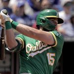
              Oakland Athletics' Seth Brown watches his solo home run during the sixth inning of a baseball game against the Kansas City Royals Sunday, June 26, 2022, in Kansas City, Mo. (AP Photo/Charlie Riedel)
            