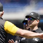 
              Pittsburgh Pirates manager Derek Shelton, left, talks with crew chief umpire Mark Wegner during the fifth inning of a baseball game against the Washington Nationals at Nationals Park, Wednesday, June 29, 2022, in Washington. (AP Photo/Alex Brandon)
            