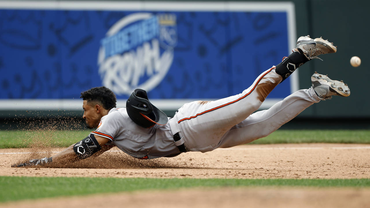 Baltimore Orioles' Richie Martin beats the throw to third base for a triple during the sixth inning...