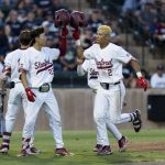 
              Stanford's Drew Bowser (2) celebrates with Eddie Park after hitting a two-run home run against Connecticut during the second inning of an NCAA college baseball tournament super regional game Saturday, June 11, 2022, in Stanford, Calif. (AP Photo/John Hefti)
            