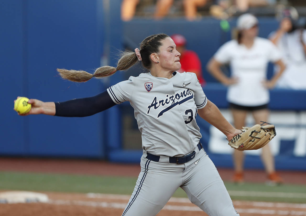 Arizona's Devyn Netz (34) pitches in the sixth inning of an NCAA softball Women's College World Ser...