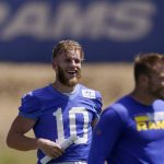 
              Los Angeles Rams wide receiver Cooper Kupp, center, laughs during an NFL mini camp football practice Wednesday, June 8, 2022, in Thousand Oaks, Calif. (AP Photo/Mark J. Terrill)
            