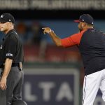 
              Washington Nationals manager Dave Martinez, right, argues with umpire Dan Iassogna after a play in the 10th inning of the second game of a baseball doubleheader against the Philadelphia Phillies, Friday, June 17, 2022, in Washington. Martinez was ejected after the play. (AP Photo/Patrick Semansky)
            