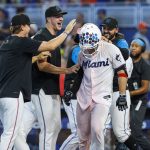 
              Miami Marlins' Nick Fortes, front right, celebrates with teammates after hitting a walkoff solo home run during the ninth inning of a baseball game against the New York Mets, Sunday, June 26, 2022, in Miami. (David Santiago/Miami Herald via AP)
            