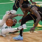 
              Boston Celtics guard Jaylen Brown (7) and Golden State Warriors forward Draymond Green (23) scramble for a loose ball during the second quarter of Game 3 of basketball's NBA Finals, Wednesday, June 8, 2022, in Boston. (AP Photo/Steven Senne)
            