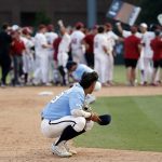 
              North Carolina's Johnny Castagnozzi (19) reacts as Arkansas celebrates in the background following an NCAA college super regional baseball game in Chapel Hill, N.C., Sunday, June 12, 2022. (AP Photo/Karl B DeBlaker)
            