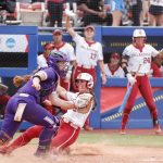 
              Oklahoma's Grace Lyons, front right,slides into home ahead of the ball in the third inning of an NCAA softball Women's College World Series game against Northwestern on Thursday, June 2, 2022, in Oklahoma City. (AP Photo/Alonzo Adams)
            