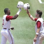 
              Oklahoma Kendall Pettis (7) and Wallace Clark (6) celebrate after Pettis hit a home run against Liberty during the first game of the Gainesville Regionals in the NCAA college Division 1 baseball championships in Gainesville, Fla., Friday, June 3, 2022. (Brad McClenny/The Gainesville Sun via AP)
            