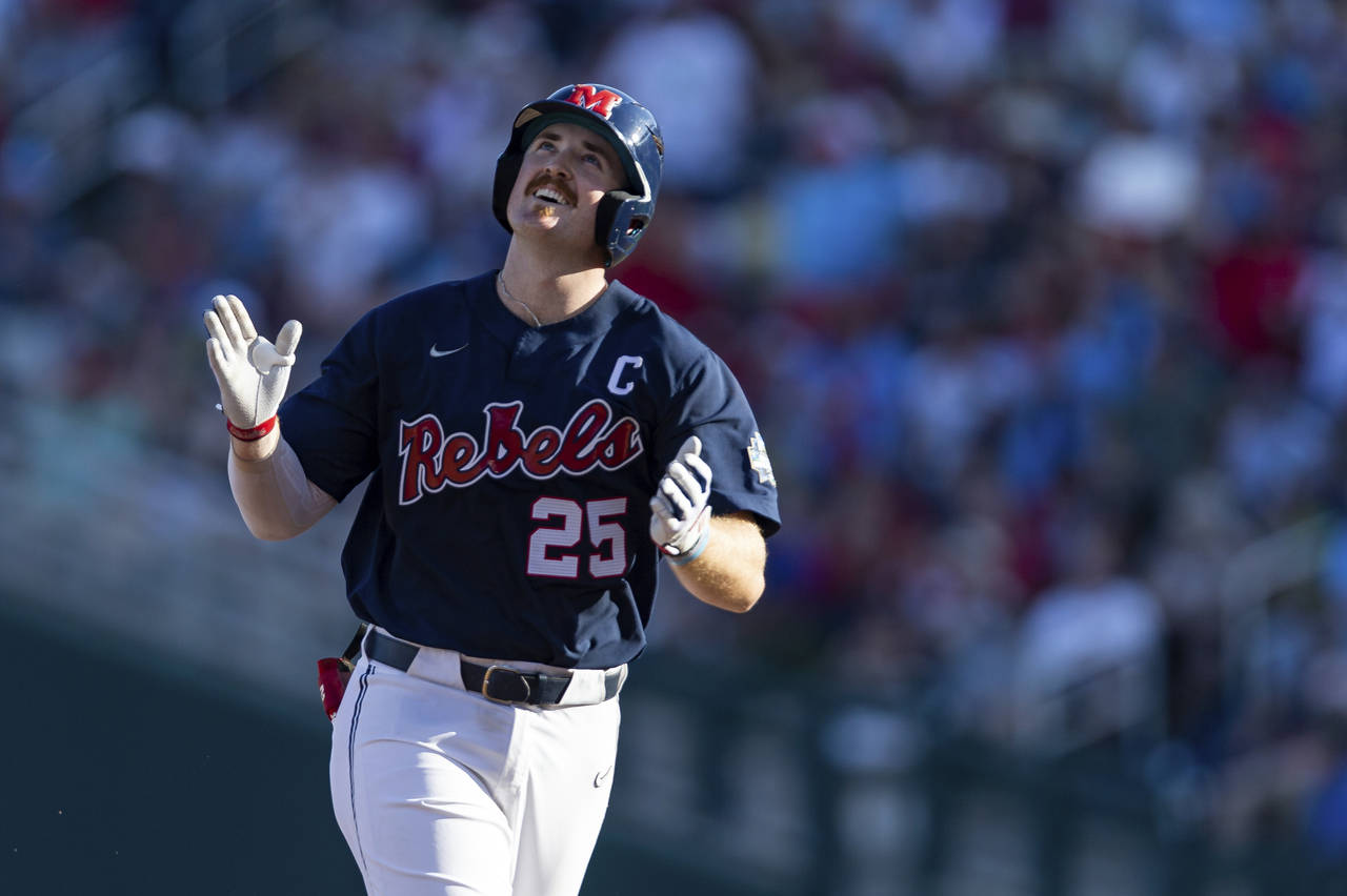 Mississippi's Tim Elko (25) runs the bases after hitting a home run against Arkansas in the first i...