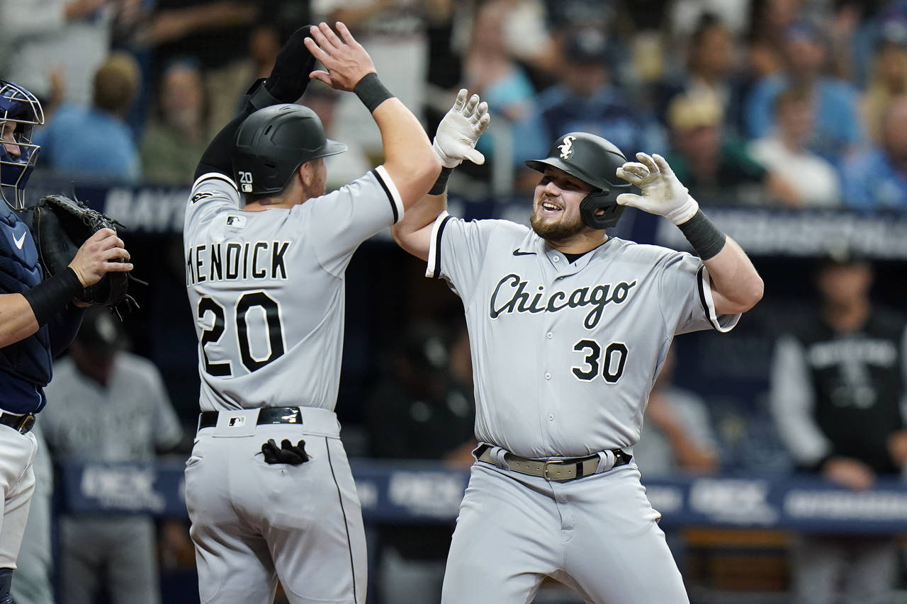 Chicago White Sox's Jake Burger (30) celebrates his two-run home run off Tampa Bay Rays relief pitc...