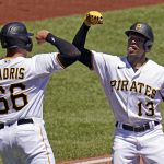 
              Pittsburgh Pirates' Ke'Bryan Hayes (13) celebrates with Bligh Madris after hitting a two-run home run off Chicago Cubs starting pitcher Justin Steele during the third inning of a baseball game in Pittsburgh, Thursday, June 23, 2022. (AP Photo/Gene J. Puskar)
            
