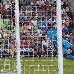 
              Grenada goalkeeper Jason Belfon (1) watches a shot by U.S. forward Jesus Ferriera, not seen, fly past him for a goal during the second half of a CONCACAF Nations League soccer match in Austin, Texas, Friday, June 10, 2022. (AP Photo/Chuck Burton)
            