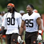 
              Cleveland Browns' Myles Garrett (95) and Jadeveon Clowney (90) take part in drills at the NFL football team's practice facility Tuesday, June 14, 2022, in Berea, Ohio. (AP Photo/Ron Schwane)
            