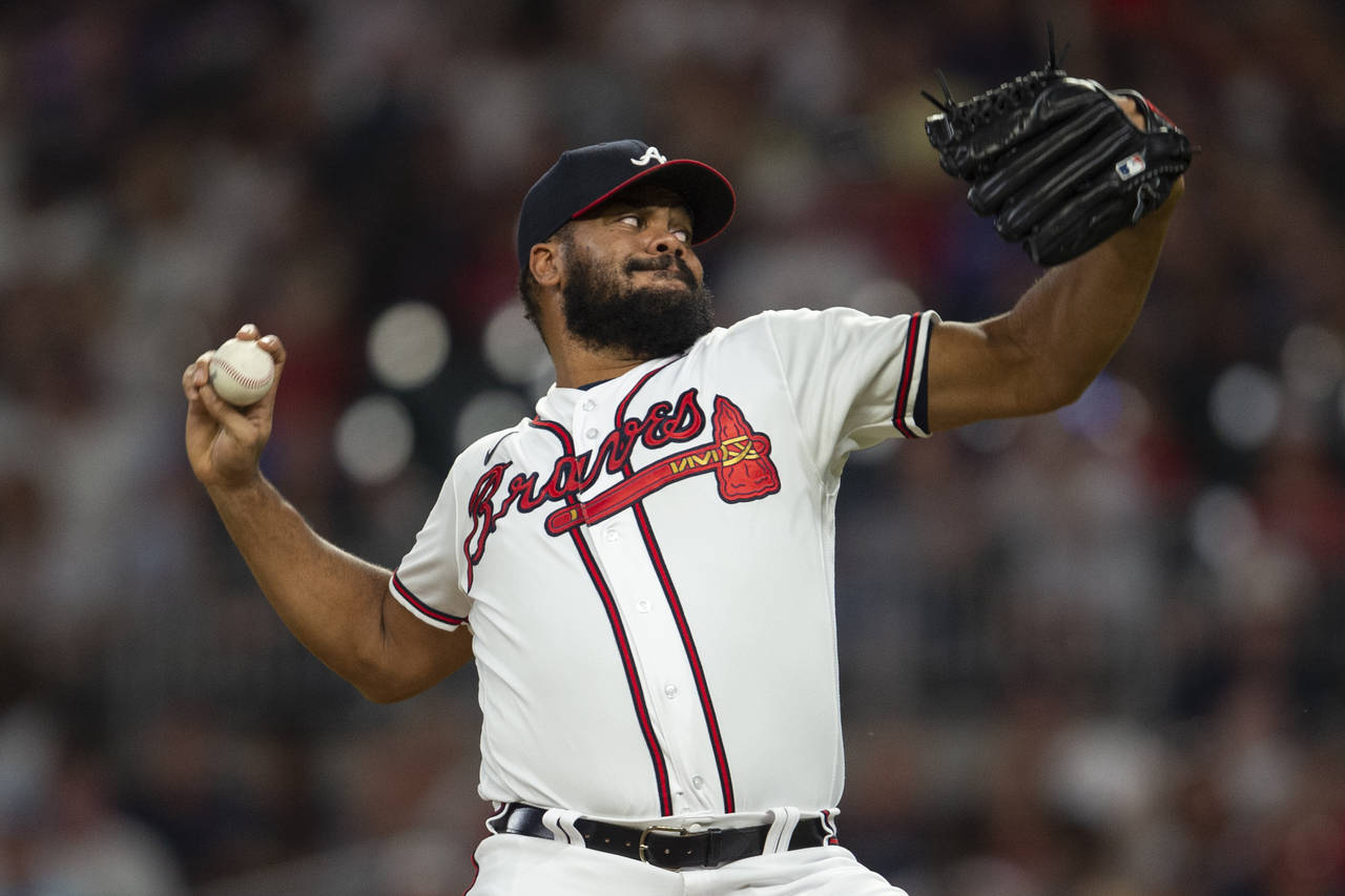 Atlanta Braves relief pitcher Kenley Jansen works in the eighth inning of a baseball game against t...