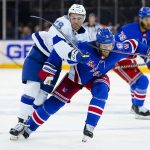 
              New York Rangers defenseman K'Andre Miller (79) and New York Rangers defenseman Jacob Trouba (8) chase down the puck during the third period in Game 5 of the NHL Hockey Stanley Cup playoffs Eastern Conference Finals, Thursday, June 9, 2022, in New York (AP Photo/Frank Franklin II)
            