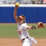 
              Texas starting pitcher Hailey Dolcini (27) pitches in the first inning of an NCAA Women's College World Series softball game against Oklahoma on Saturday, June 4, 2022, in Oklahoma City. (AP Photo/Alonzo Adams)
            