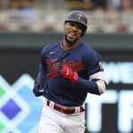 
              Minnesota Twins' Byron Buxton smiles while running the bases after hitting a home run during the first inning of the team's baseball game against the Tampa Bay Rays, Friday, June 10, 2022, in Minneapolis. (AP Photo/Stacy Bengs)
            