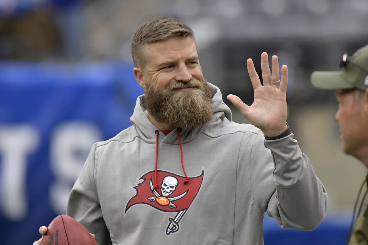 FILE - Tampa Bay Buccaneers quarterback Ryan Fitzpatrick waves to fans before an NFL football game ...