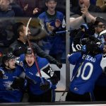 
              Saint John Sea Dogs' Brady Burns, William Dufour, and Riley Bezeau, from left, celebrate near the end of the team's win over the Hamilton Bulldogs in the Memorial Cup hockey final, Wednesday, June 29, 2022, in Saint John, New Brunswick. (Ron Ward/The Canadian Press via AP)
            