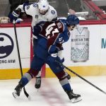
              Colorado Avalanche center Darren Helm (43) collides with Tampa Bay Lightning right wing Nikita Kucherov during the second period in Game 2 of the NHL hockey Stanley Cup Final on Saturday, June 18, 2022, in Denver. (AP Photo/David Zalubowski)
            