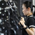 
              Yoshimi Yamashita of Japan, one of three women picked to be head referees at the men's soccer World Cup, works out at a gym on Monday, June 27, 2022, at JFA YUME Field in Chiba, near Tokyo. (AP Photo/Eugene Hoshiko)
            