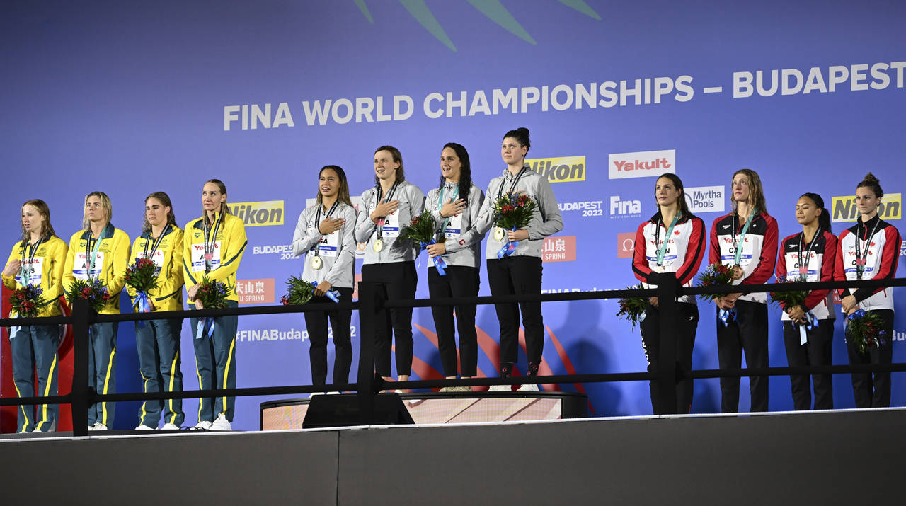 Silver medalists team of Australia, left, gold medalist team of United States, centre, bronze medal...
