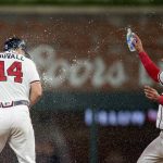 
              Atlanta Braves Orlando Arcia, right, throws water in celebration on Adam Duvall (14) in the ninth inning of a baseball game against the San Francisco Giants Wednesday, June 22, 2022, in Atlanta. (AP Photo/Hakim Wright Sr.)
            
