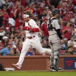 
              St. Louis Cardinals' Brendan Donovan, left, scores past Miami Marlins catcher Nick Fortes (54) during the fifth inning of a baseball game Tuesday, June 28, 2022, in St. Louis. (AP Photo/Jeff Roberson)
            