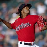 
              Cleveland Guardians starting pitcher Triston McKenzie throws against the Minnesota Twins during the first inning of a baseball game Monday, June 27, 2022, in Cleveland. (AP Photo/Ron Schwane)
            