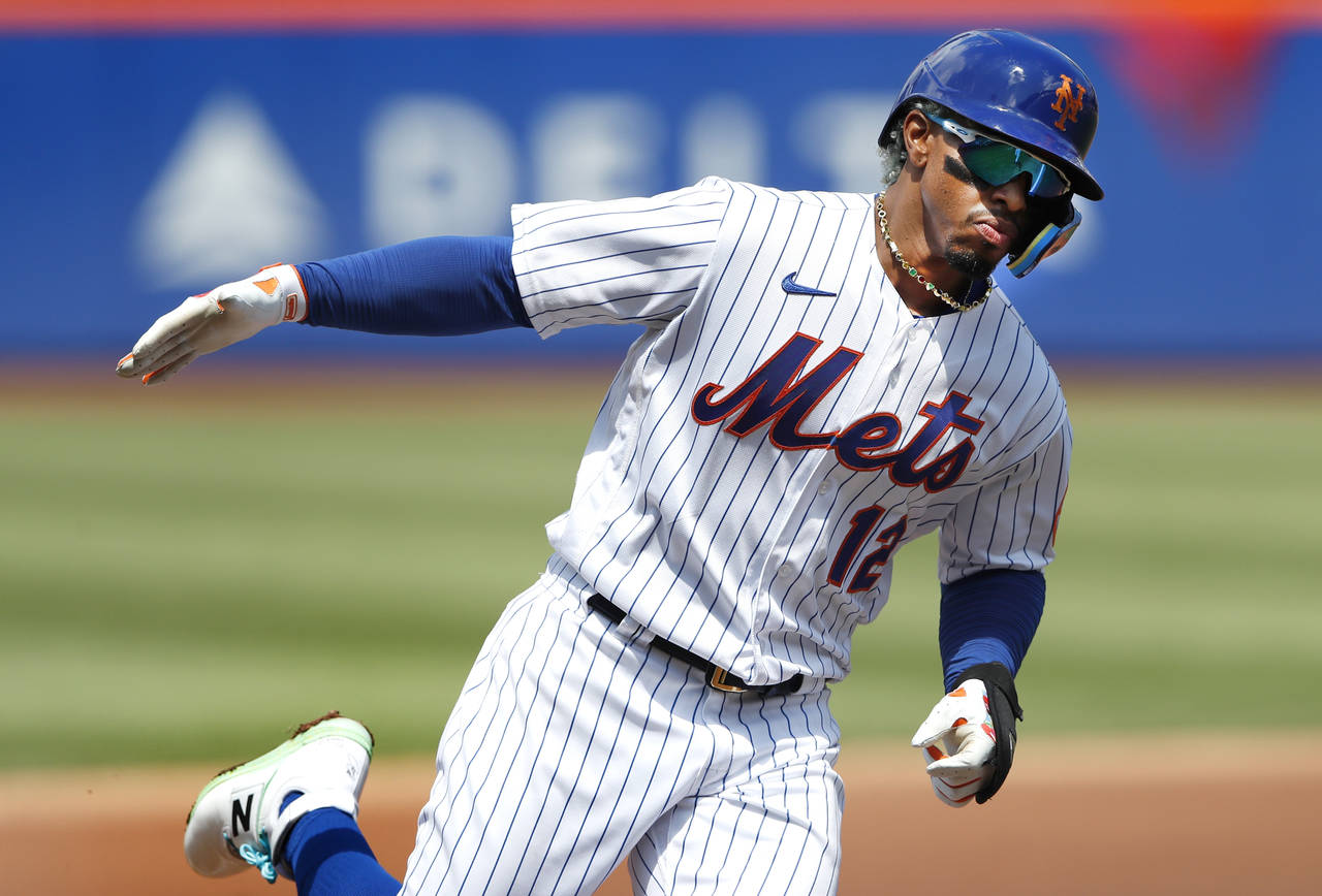 New York Mets' Francisco Lindor rounds the bases after hitting a home run against the Seattle Marin...