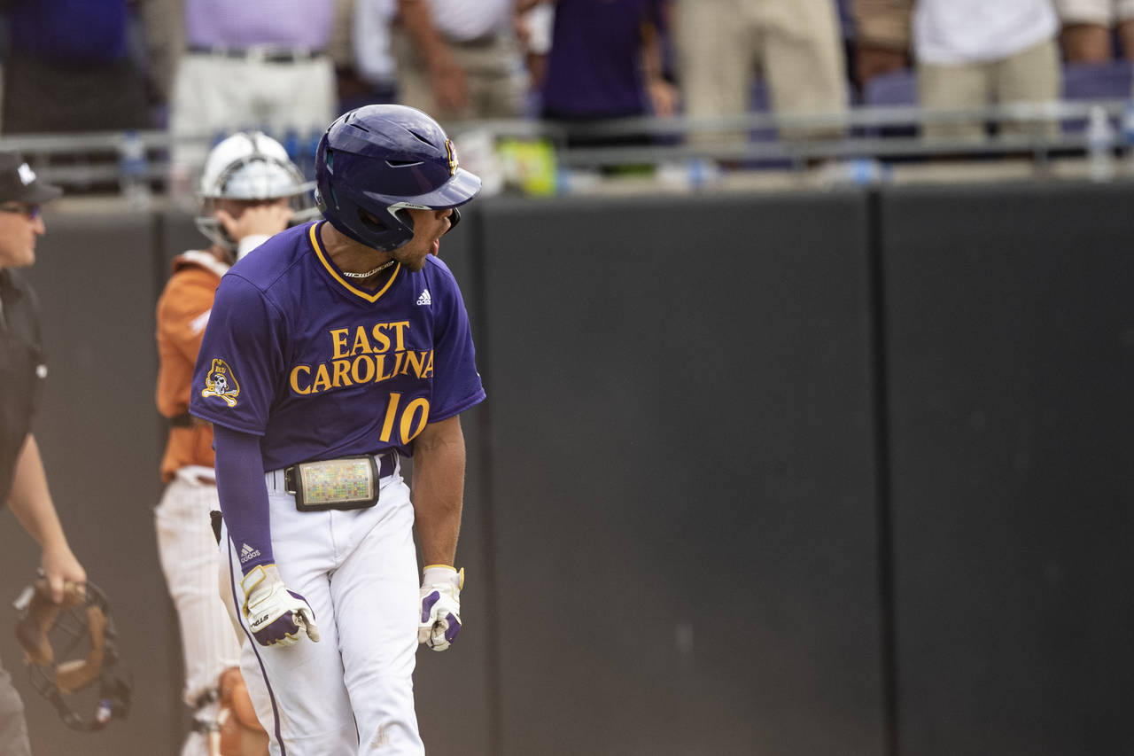 East Carolina's Jacob Starling reacts to hitting a home run during the ninth inning of an NCAA coll...
