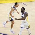 
              Golden State Warriors guard Stephen Curry, left, celebrates with forward Draymond Green during the first half of Game 1 of basketball's NBA Finals against the Boston Celtics in San Francisco, Thursday, June 2, 2022. (AP Photo/John Hefti)
            