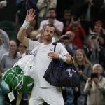 
              Britain's Andy Murray waves after losing the singles tennis match against John Isner of the US on day three of the Wimbledon tennis championships in London, Wednesday, June 29, 2022. (AP Photo/Alastair Grant)
            