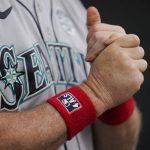 
              Seattle Mariners manager Scott Servais wears wrist bands in honor of Lou Gehrig Day prior to a baseball game against the Baltimore Orioles, Thursday, June 2, 2022, in Baltimore. (AP Photo/Julio Cortez)
            