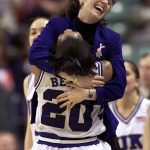 
              FILE - Then-Duke coach Gail Goestenkors hugs Alana Beard after Duke defeated North Carolina 87-80 for the ACC Women's Basketball championship at the Greensboro Coliseum on March 4, 2002 in Greensboro, N.C. Goestenkors, a Women's Basketball Hall of Famer and Kentucky women’s basketball assistant, has retired from on-court coaching but will remain on coach Kyra Elzy’s staff until her replacement is hired.(AP Photo/Gerry Broome, File)
            